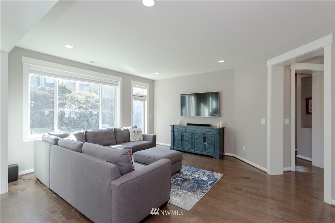 762 Lyons Avenue Northeast Renton, WA 98059 - Photo 6 of 33 a living room with furniture and a flat screen tv