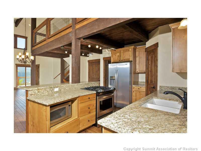 173 Co Road Breckenridge, CO 80424 - Photo 15 of 25 a kitchen with a stove and a refrigerator