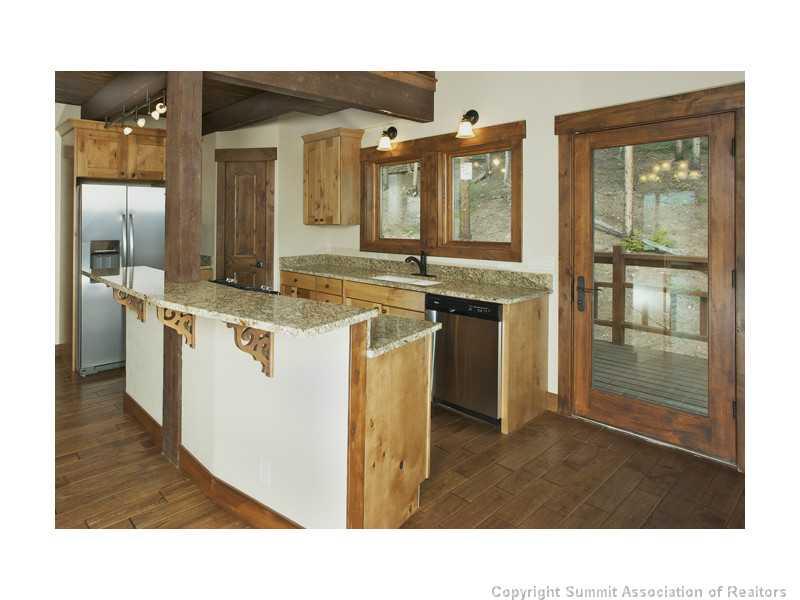 173 Co Road Breckenridge, CO 80424 - Photo 3 of 25 a open kitchen with stainless steel appliances granite countertop a sink and a refrigerator