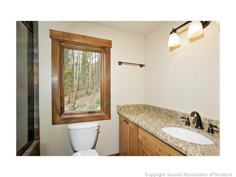 173 Co Road Breckenridge, CO 80424 - Photo 24 of 25 a bathroom with a granite countertop sink mirror and tub