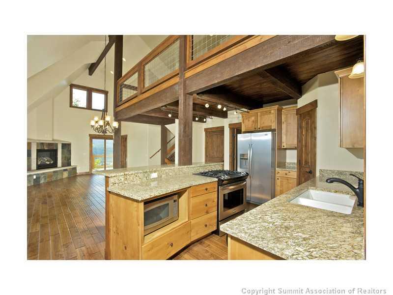173 Co Road Breckenridge, CO 80424 - Photo 5 of 25 a kitchen with stainless steel appliances granite countertop a sink and a refrigerator