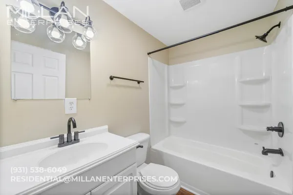 a bathroom with a sink a toilet and a bathtub