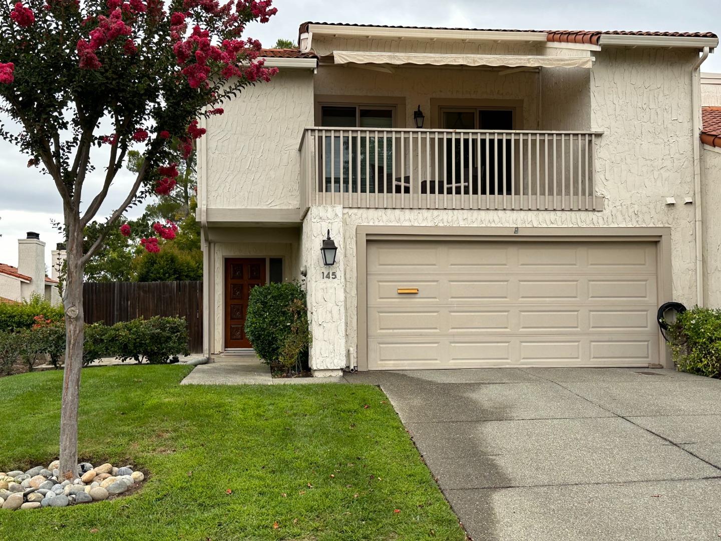 145 Calle Larga Los Gatos, CA 95032 - Photo 1 of 26 a front view of a house with garden