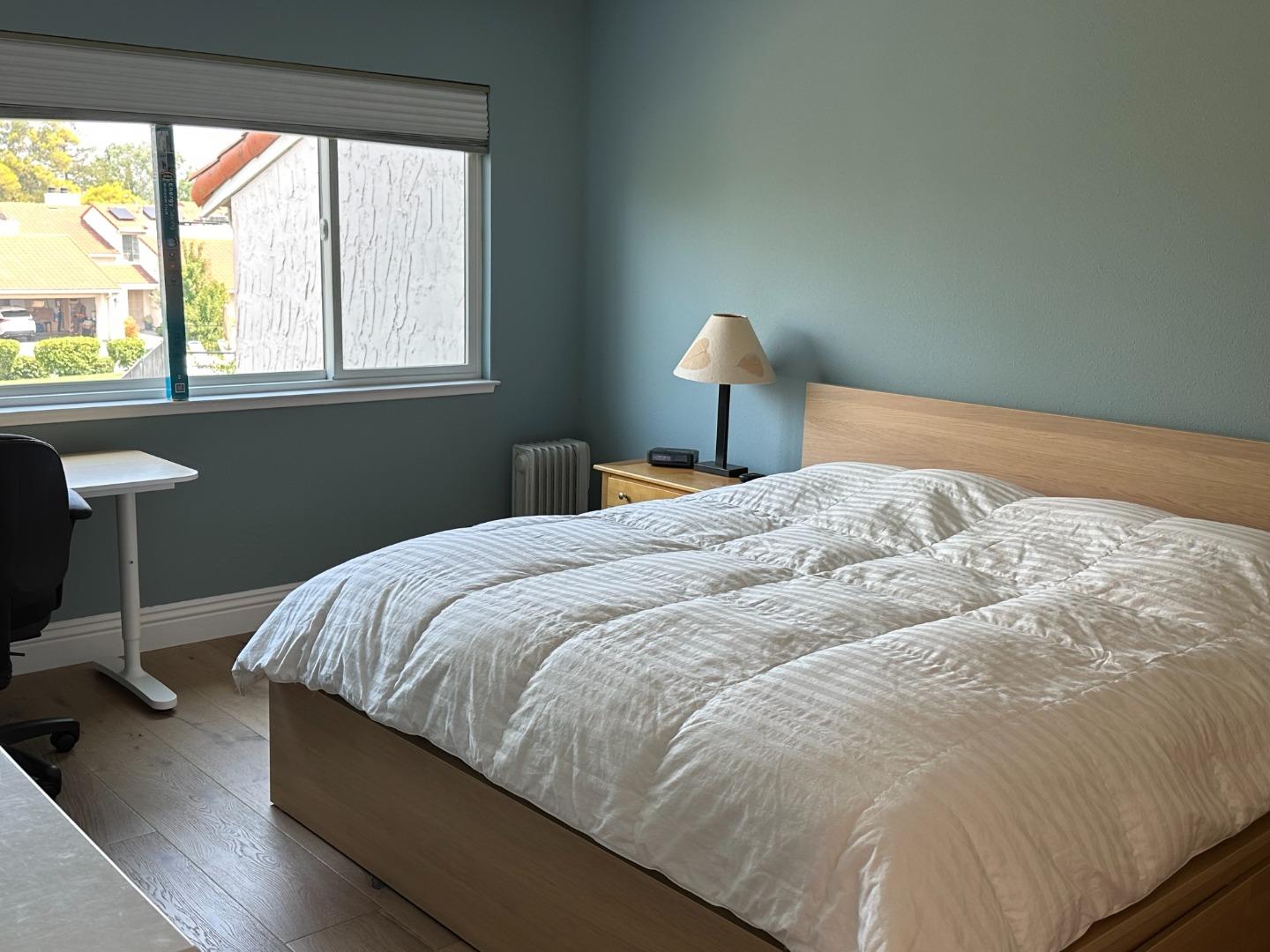 145 Calle Larga Los Gatos, CA 95032 - Photo 11 of 26 a bedroom with a bed and a lamp next to a window