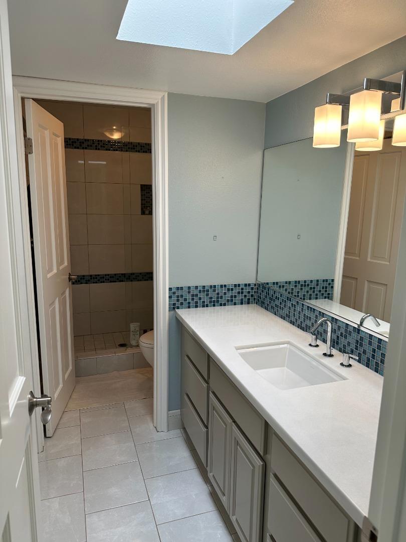 145 Calle Larga Los Gatos, CA 95032 - Photo 12 of 26 a bathroom with a sink and mirror