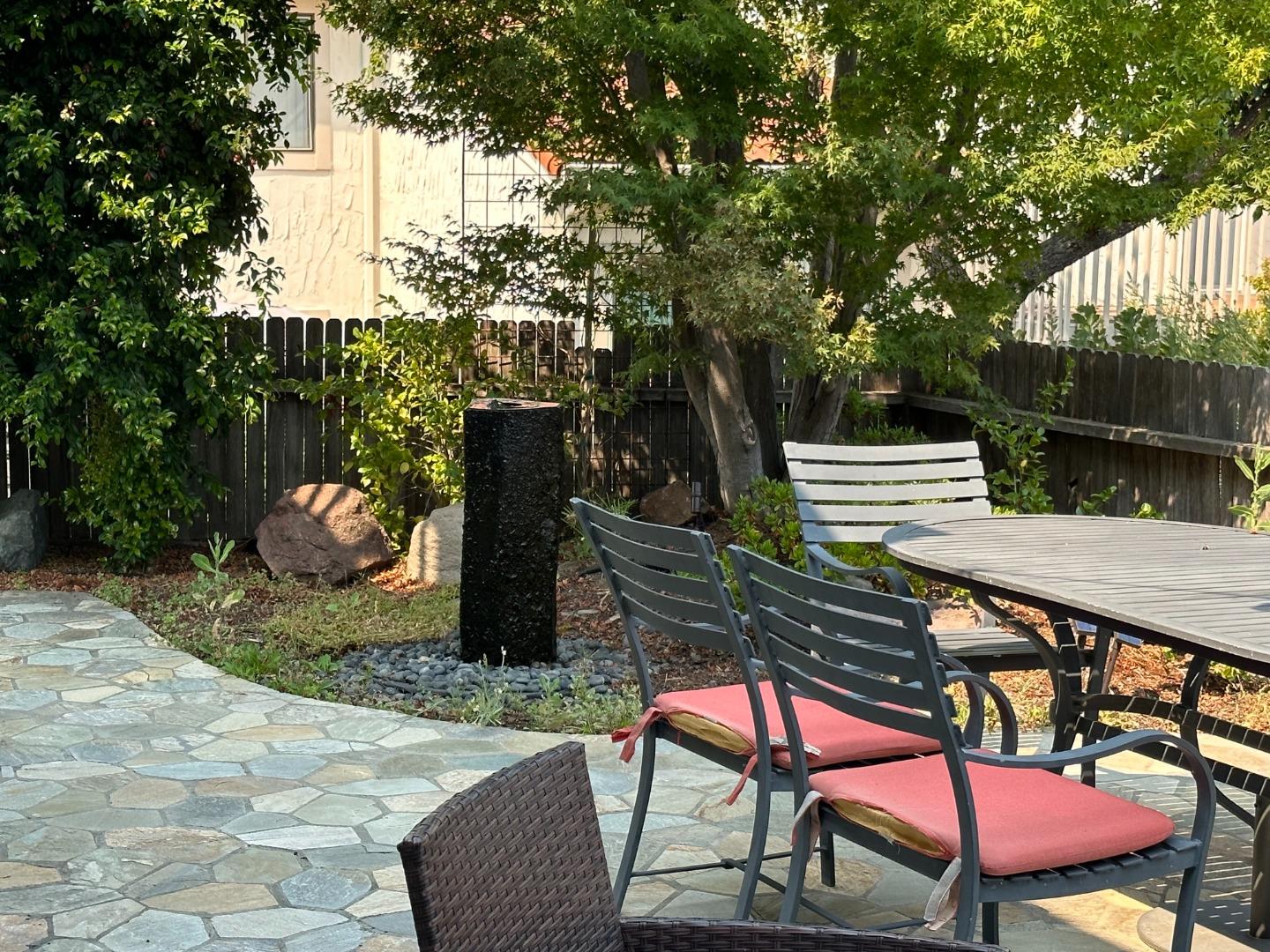 145 Calle Larga Los Gatos, CA 95032 - Photo 18 of 26 a backyard of a house with table and chairs
