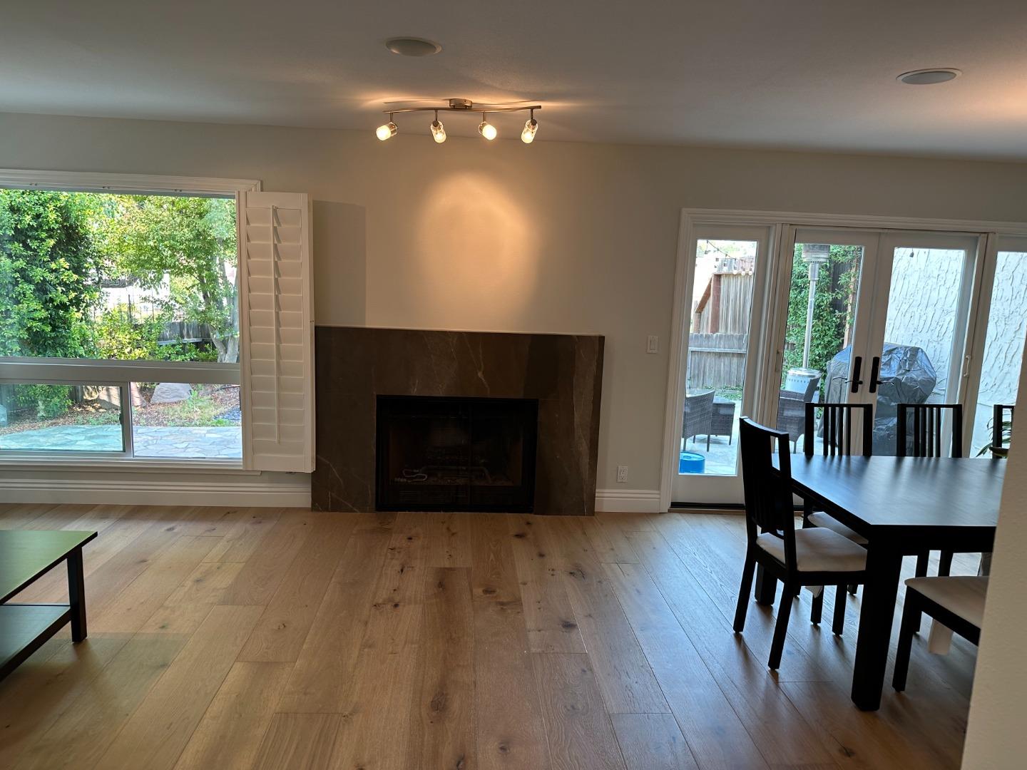 145 Calle Larga Los Gatos, CA 95032 - Photo 2 of 26 a living room with furniture and a fireplace