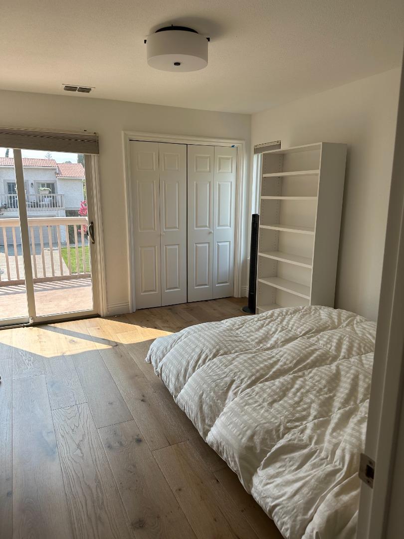145 Calle Larga Los Gatos, CA 95032 - Photo 6 of 26 a bedroom with a bed and a large window