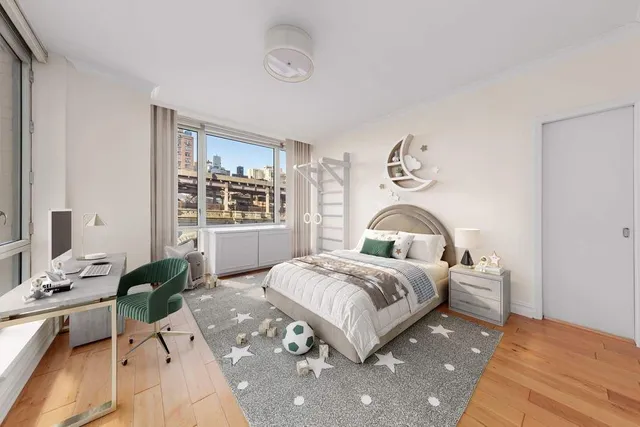 a bedroom with a bed window and a potted plant