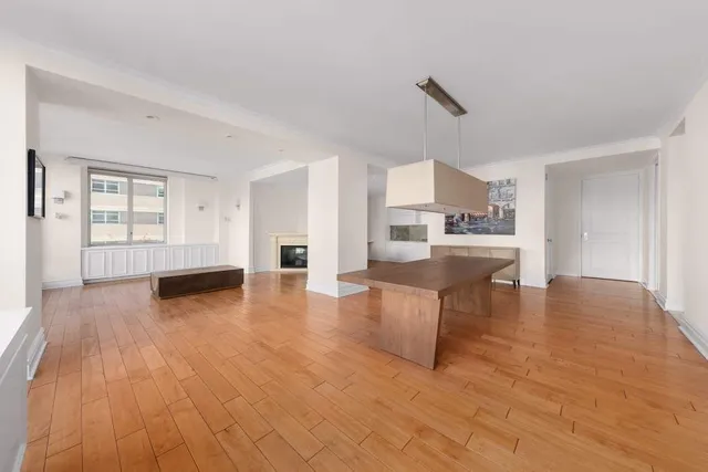 a view of a living room kitchen and a wooden floor