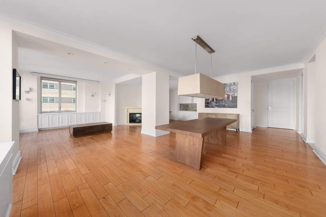 401 East 60th Street, Unit 4C Manhattan, NY 10022 - Photo 18 of 28 a view of a living room kitchen and a wooden floor