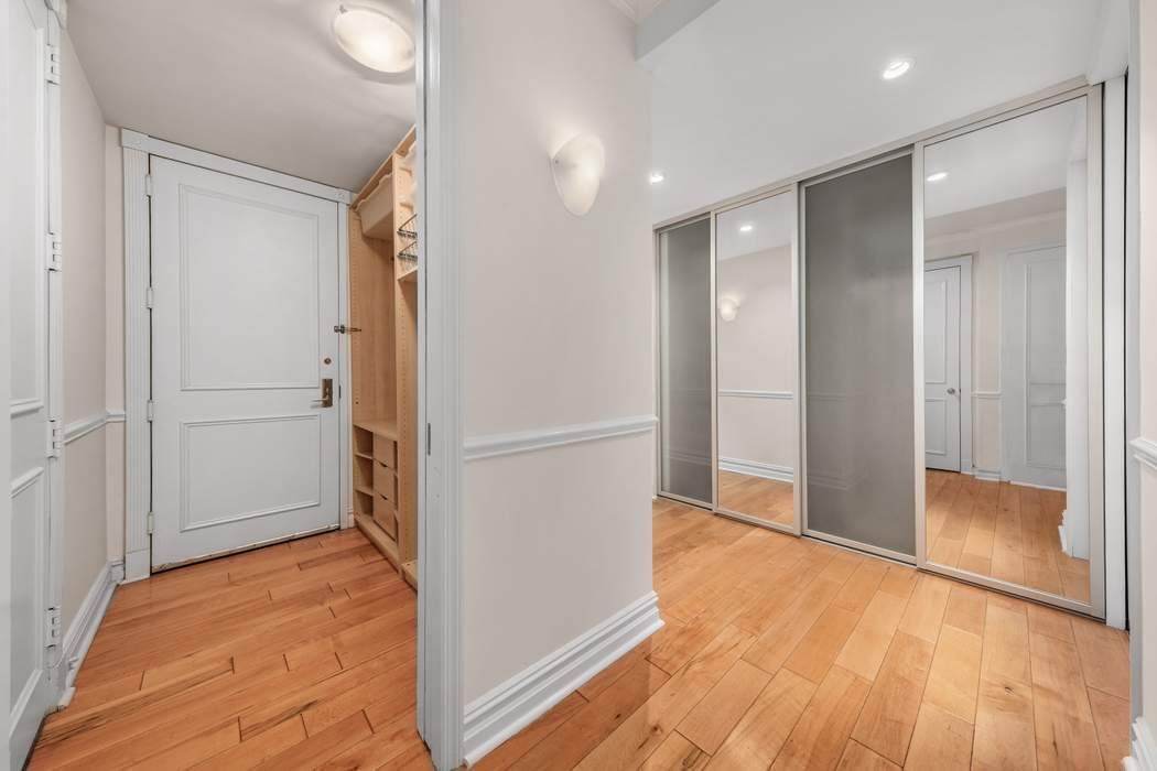 401 East 60th Street, Unit 4C Manhattan, NY 10022 - Photo 23 of 28 a view of a big room with wooden floor