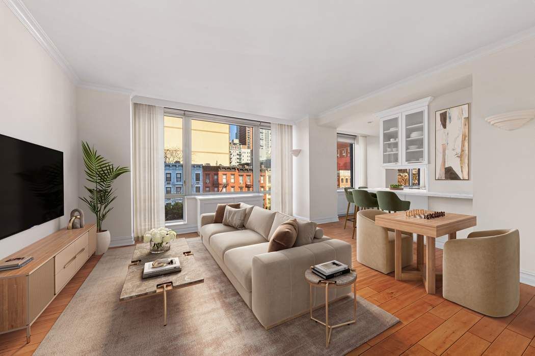 401 East 60th Street, Unit 4C Manhattan, NY 10022 - Photo 6 of 28 a living room with furniture and a flat screen tv