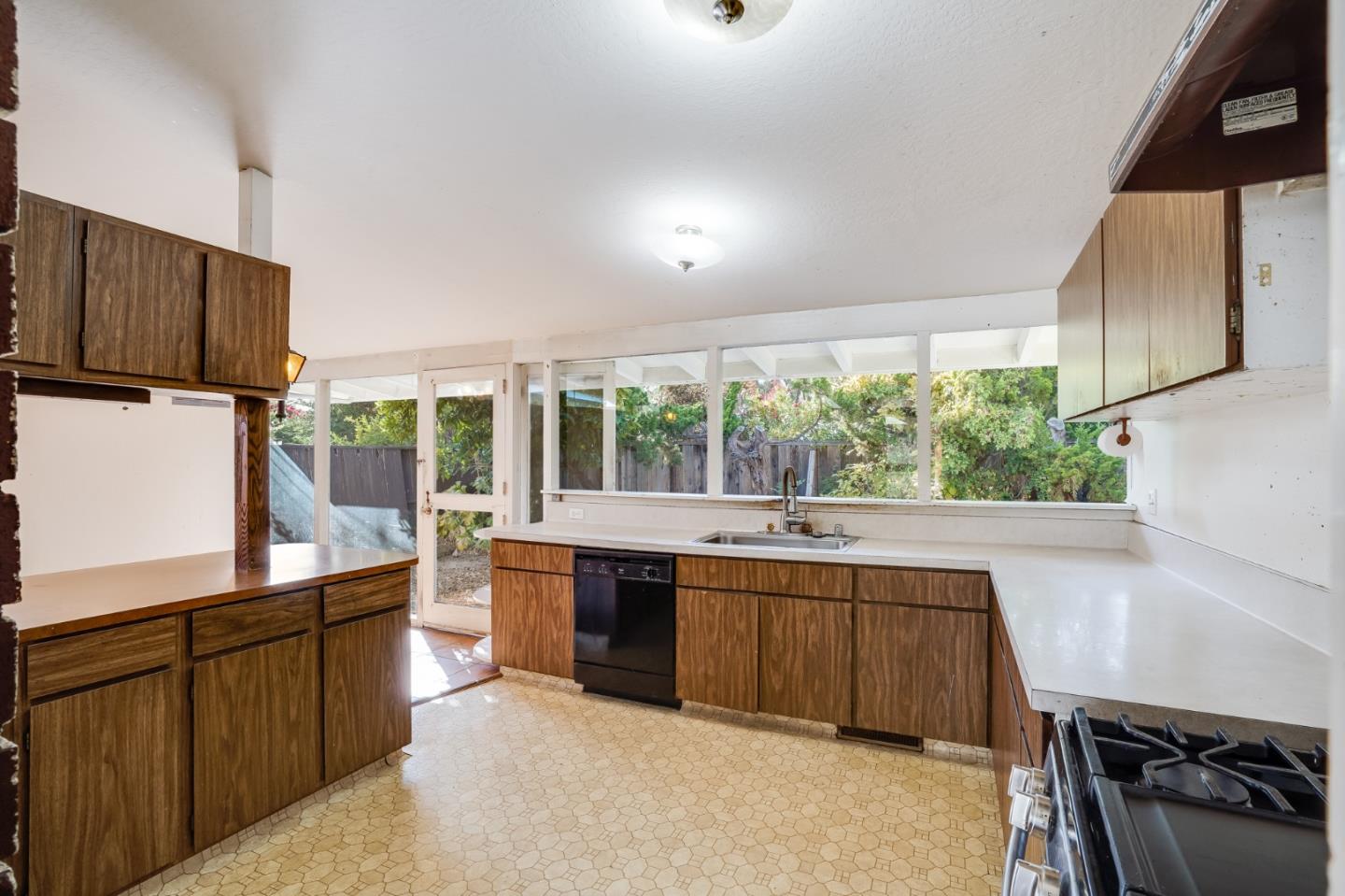 266 Thompson Avenue Mountain View, CA 94043 - Photo 11 of 25 a large kitchen with kitchen island granite countertop a sink and a stove