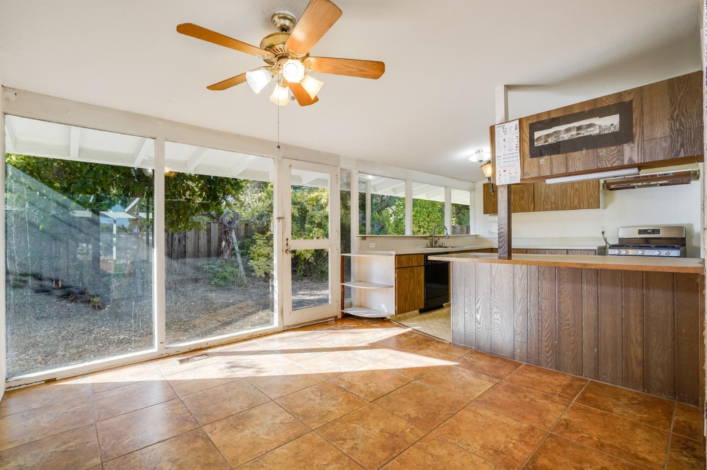 266 Thompson Avenue Mountain View, CA 94043 - Photo 10 of 25 a view of a room with a floor to ceiling window and an outdoor kitchen