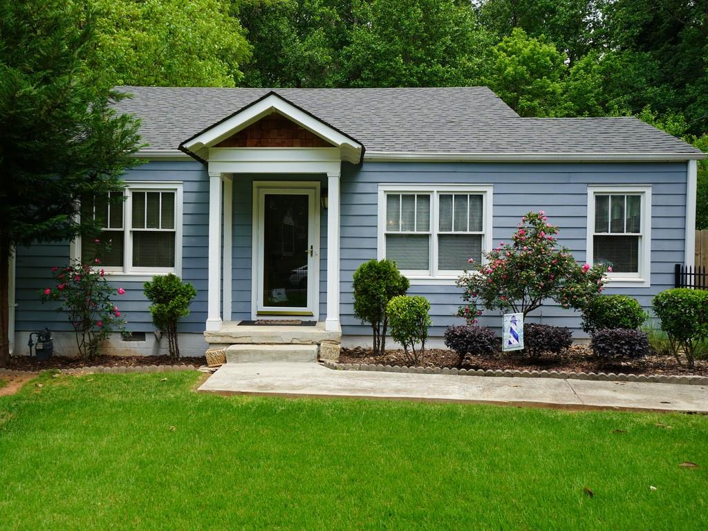2618 Charlesgate Avenue Decatur, GA 30030 - Photo 1 of 1 a front view of a house with a yard and outdoor seating