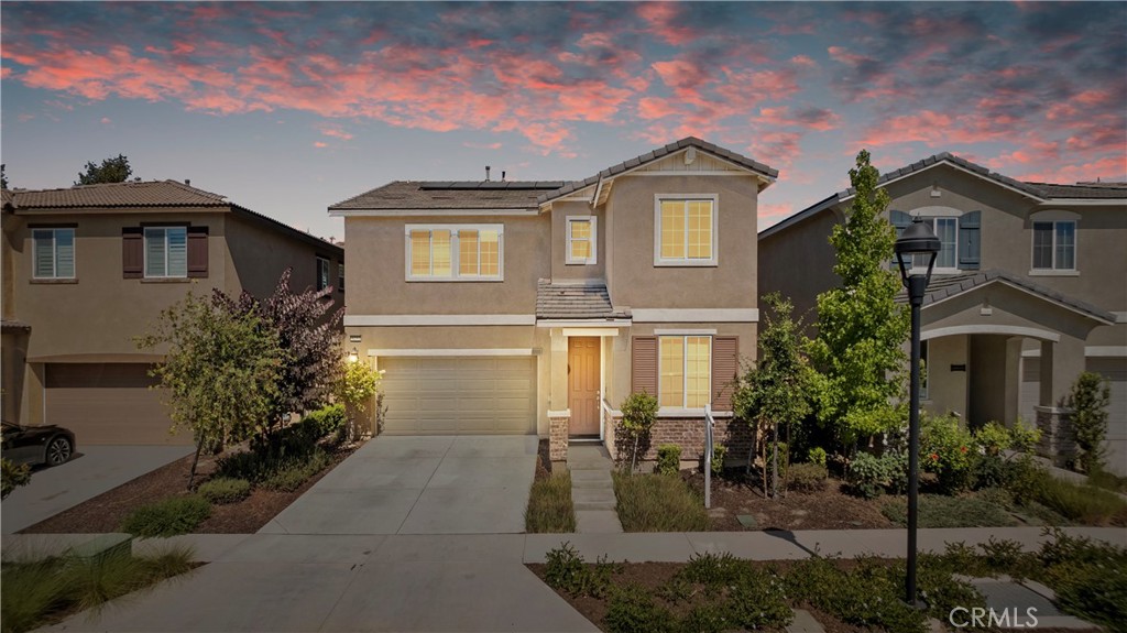 8252 Plainview Street Riverside, CA 92508 - Photo 1 of 1 a front view of a house with garden