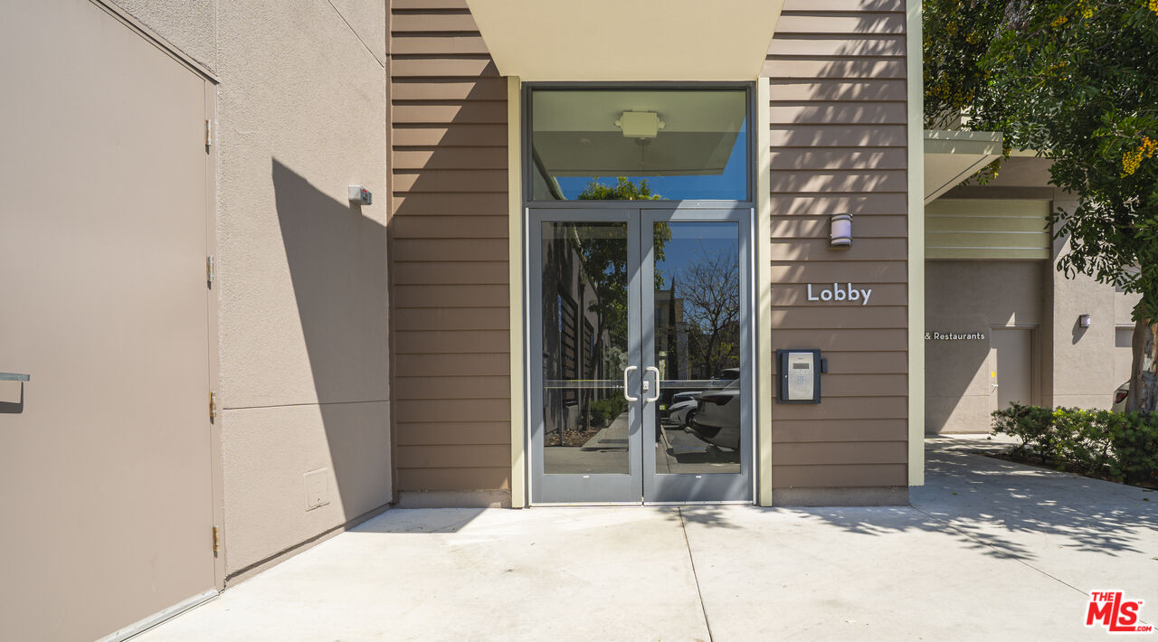 552 East Carson Street, Unit 408 Carson, CA 90745 - Photo 15 of 63 a view of a house with a door and wooden walls