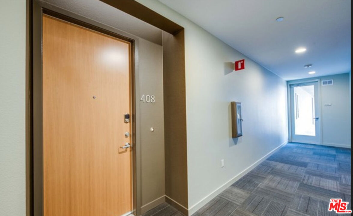 552 East Carson Street, Unit 408 Carson, CA 90745 - Photo 20 of 63 a view of livingroom with hallway and closet