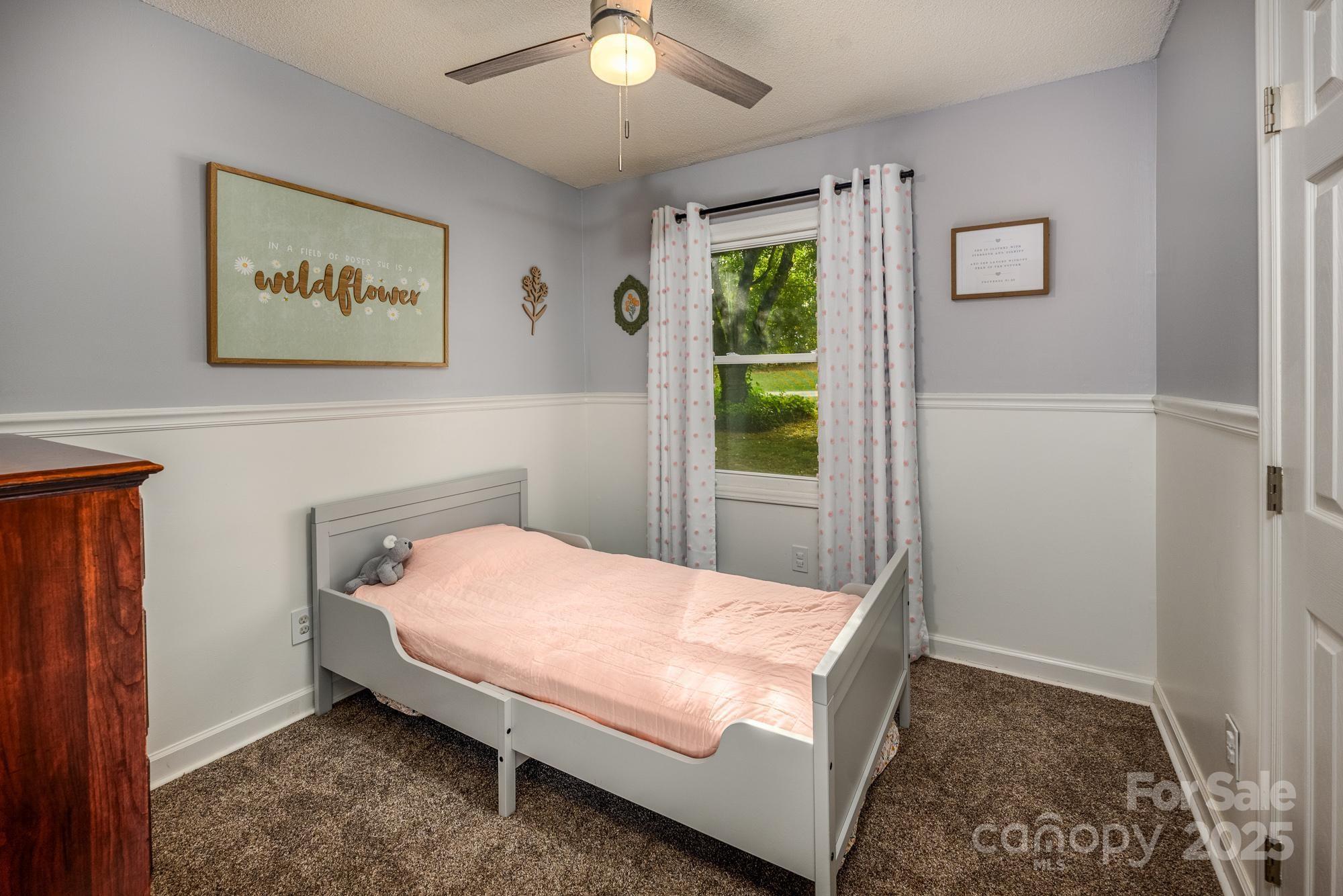 550 Brumley Road Mooresville, NC 28115 - Photo 16 of 35 a bed sitting in a bedroom next to a window