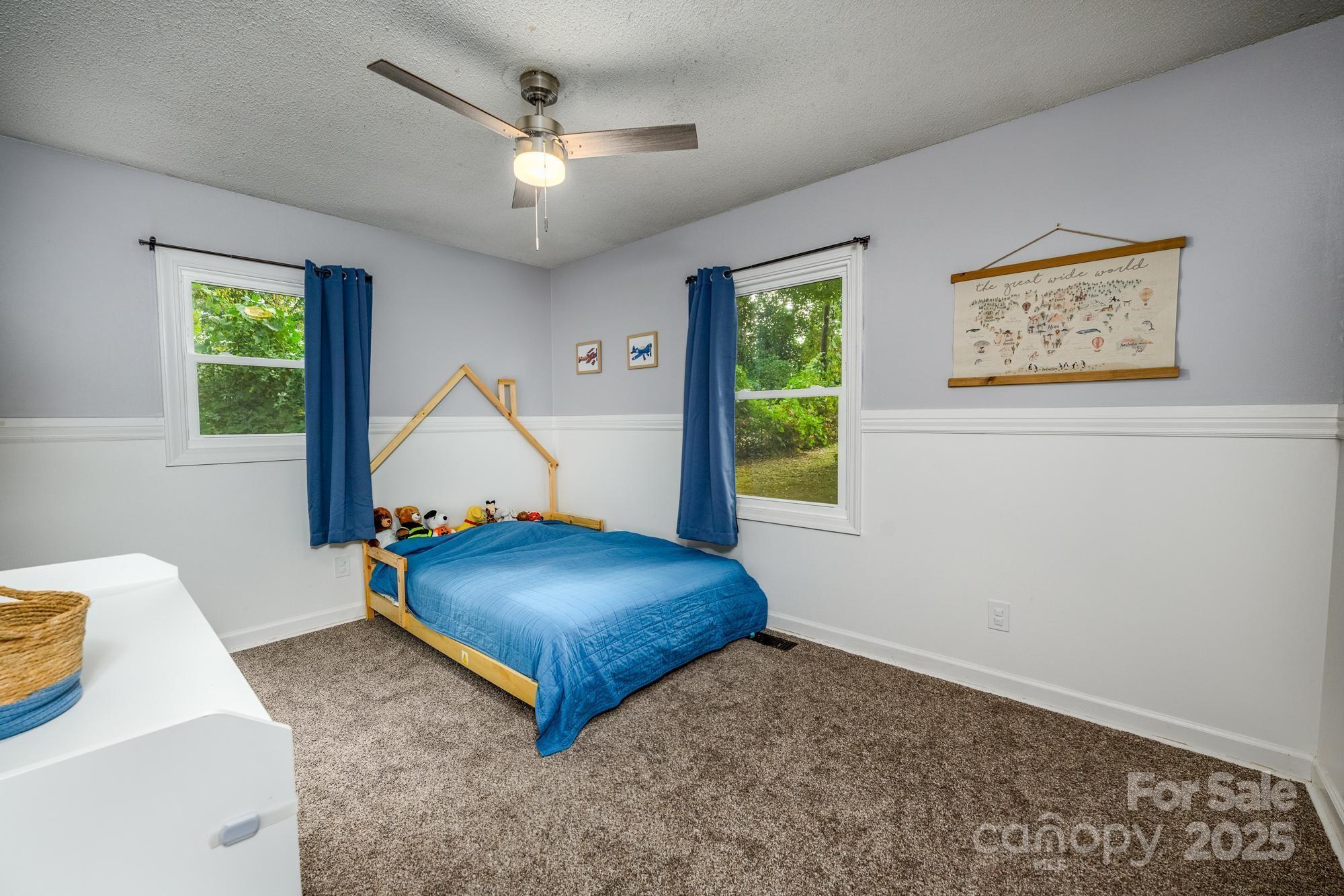550 Brumley Road Mooresville, NC 28115 - Photo 18 of 35 a room with a couch and a chandelier