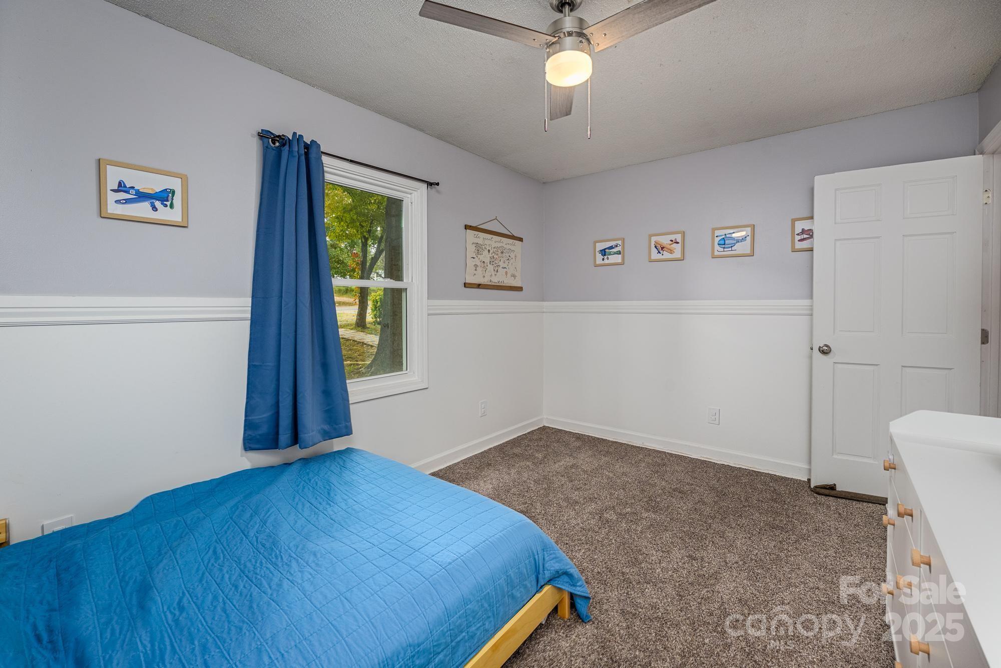 550 Brumley Road Mooresville, NC 28115 - Photo 19 of 35 a view of a bedroom with wooden floor and windows