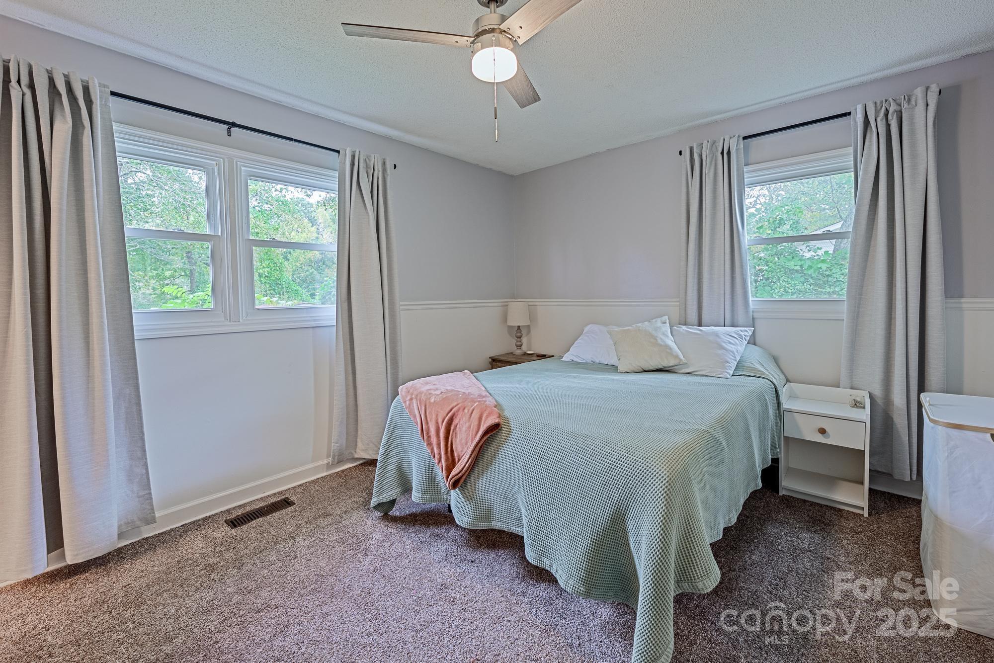 550 Brumley Road Mooresville, NC 28115 - Photo 20 of 35 a bedroom with a bed and a window