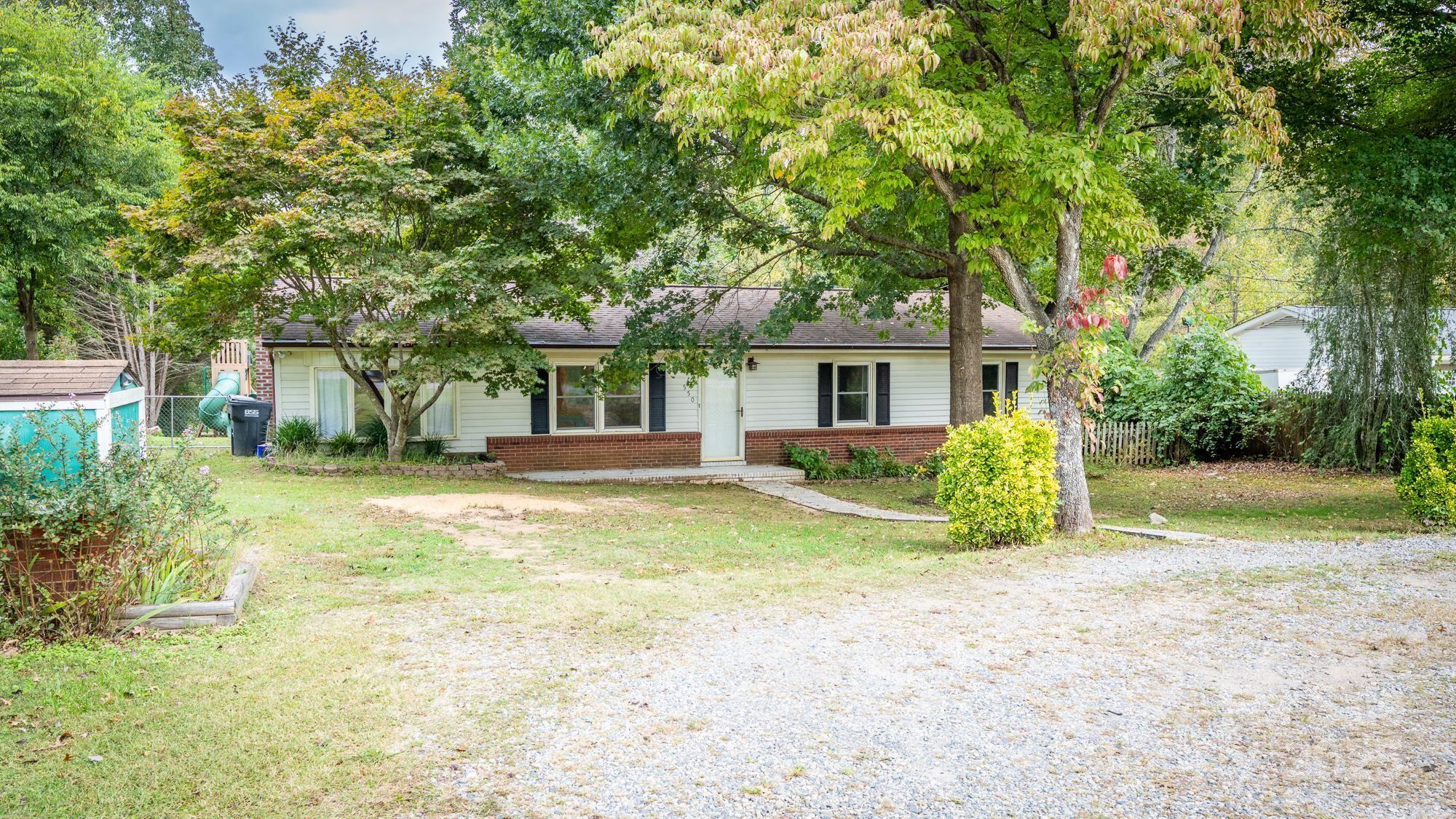 550 Brumley Road Mooresville, NC 28115 - Photo 2 of 35 a view of a house with a backyard and a tree