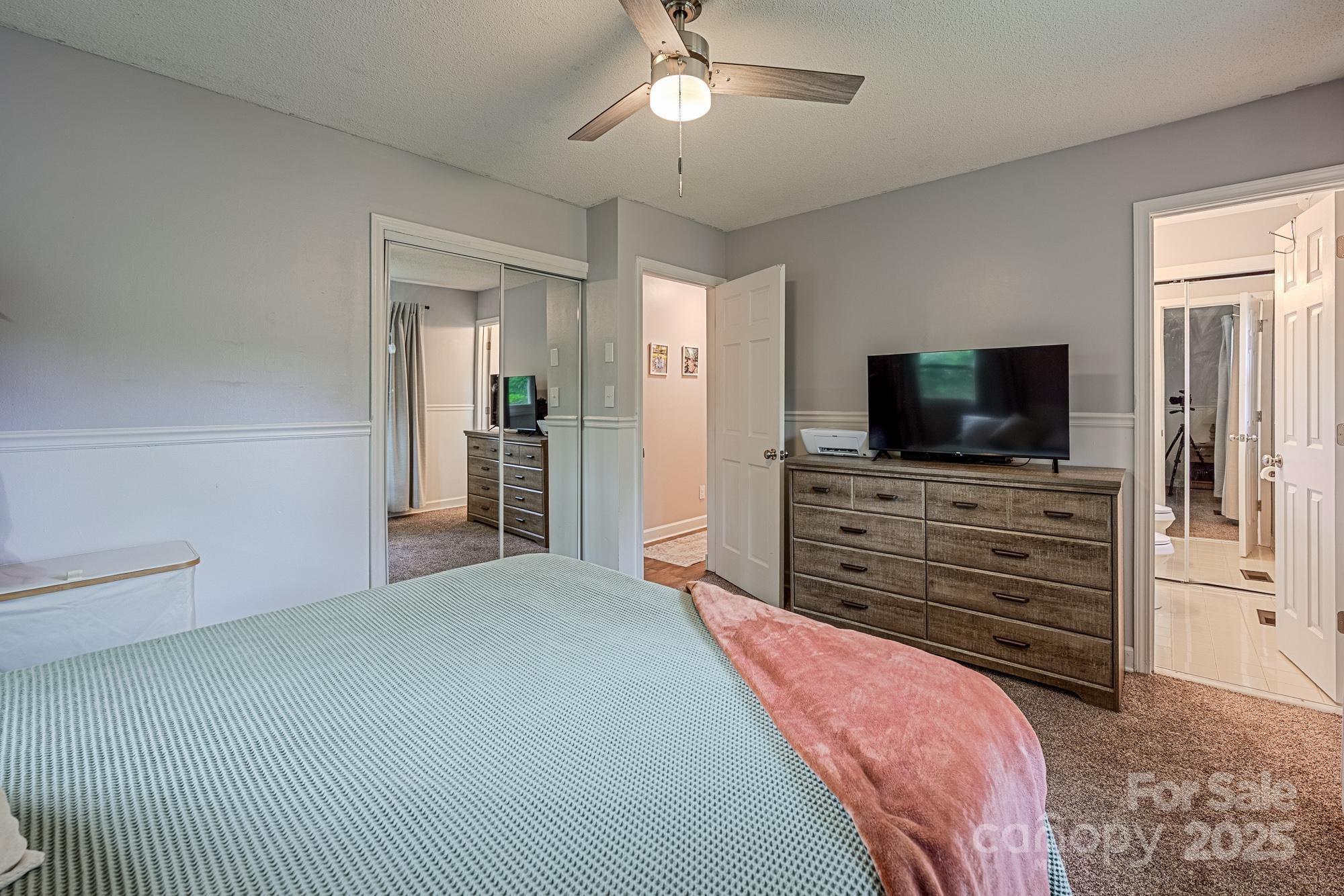 550 Brumley Road Mooresville, NC 28115 - Photo 21 of 35 a bedroom with a bed and a flat screen tv