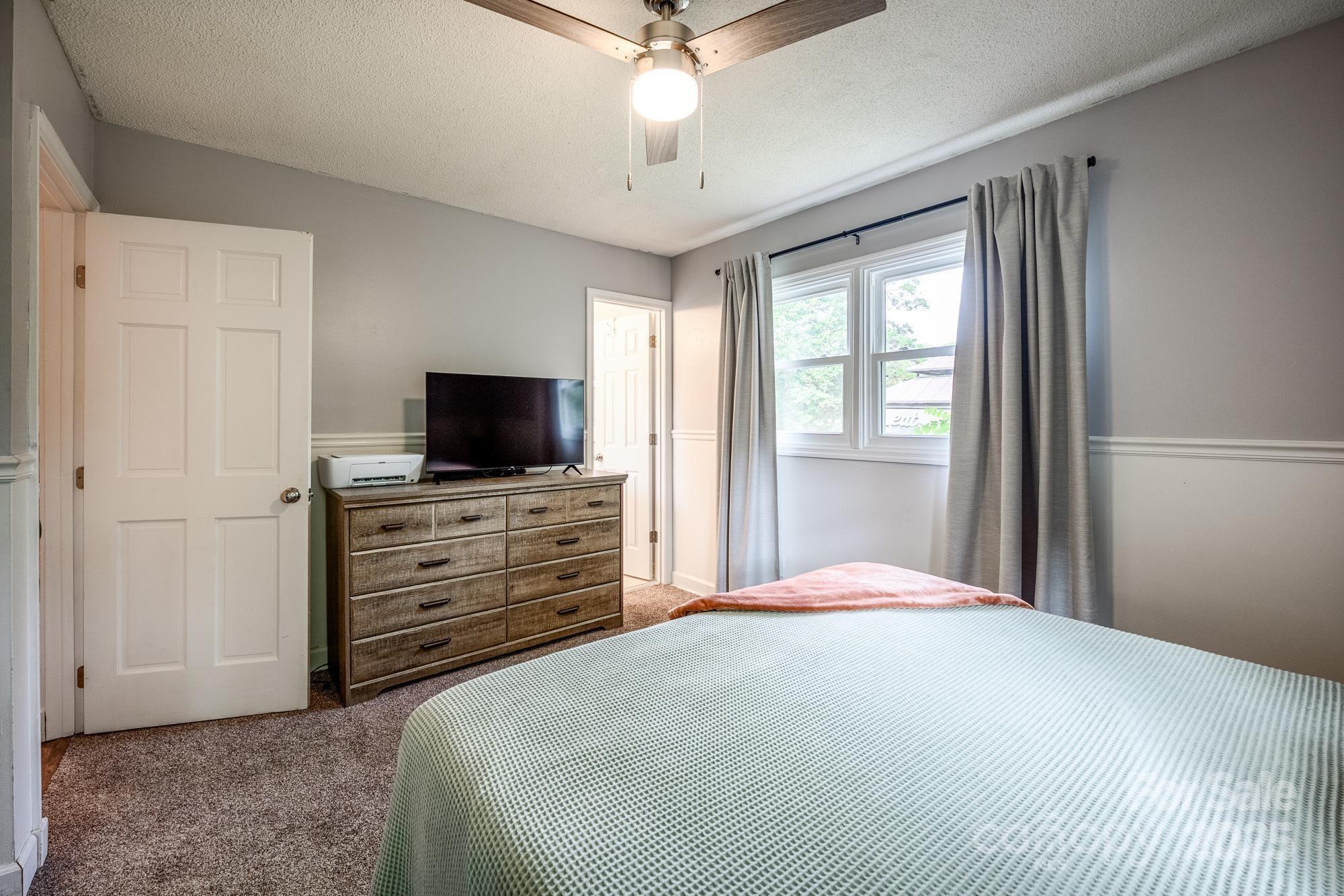 550 Brumley Road Mooresville, NC 28115 - Photo 22 of 35 a bedroom with a bed and flat screen tv