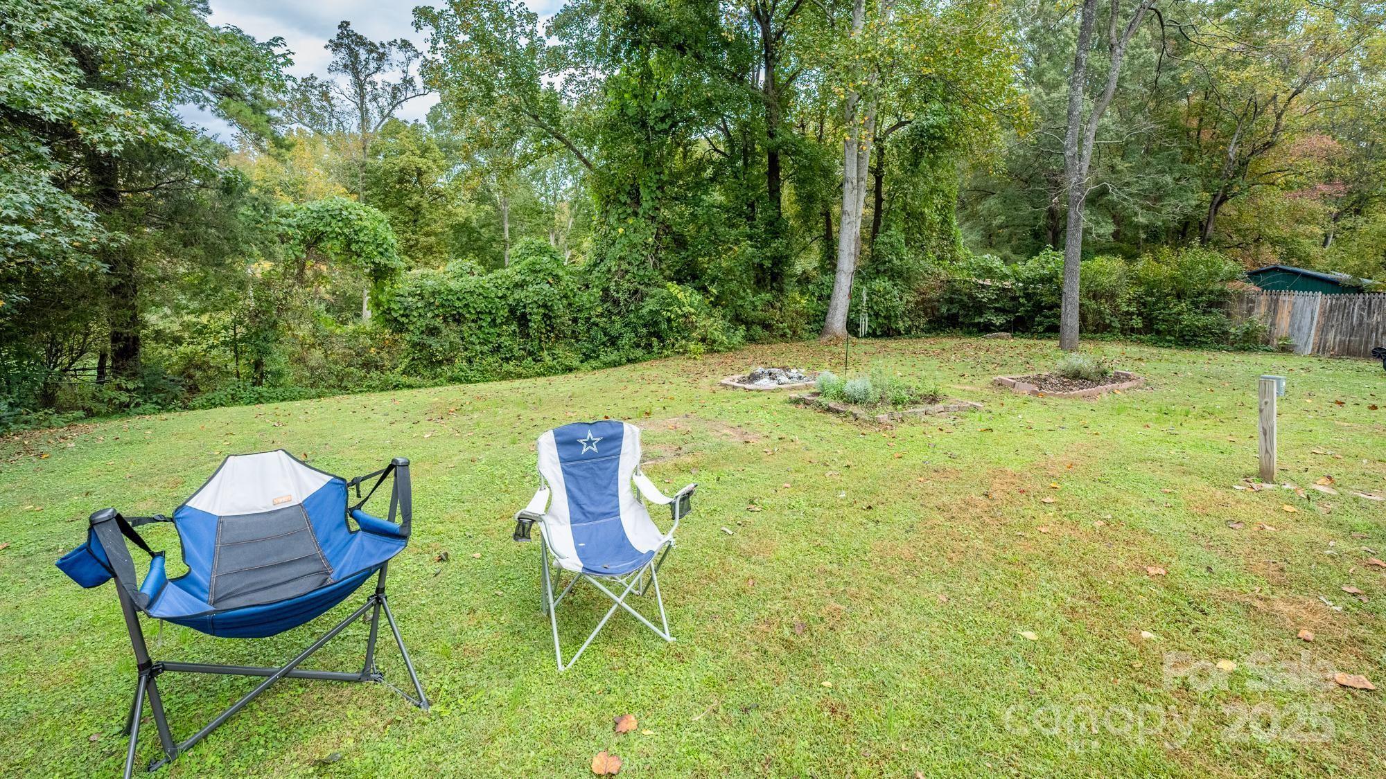 550 Brumley Road Mooresville, NC 28115 - Photo 28 of 35 a backyard of a house with table and chairs