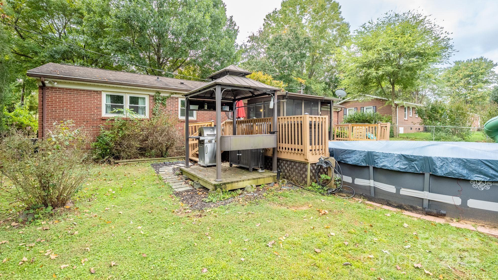 550 Brumley Road Mooresville, NC 28115 - Photo 30 of 35 a view of house with backyard and seating area