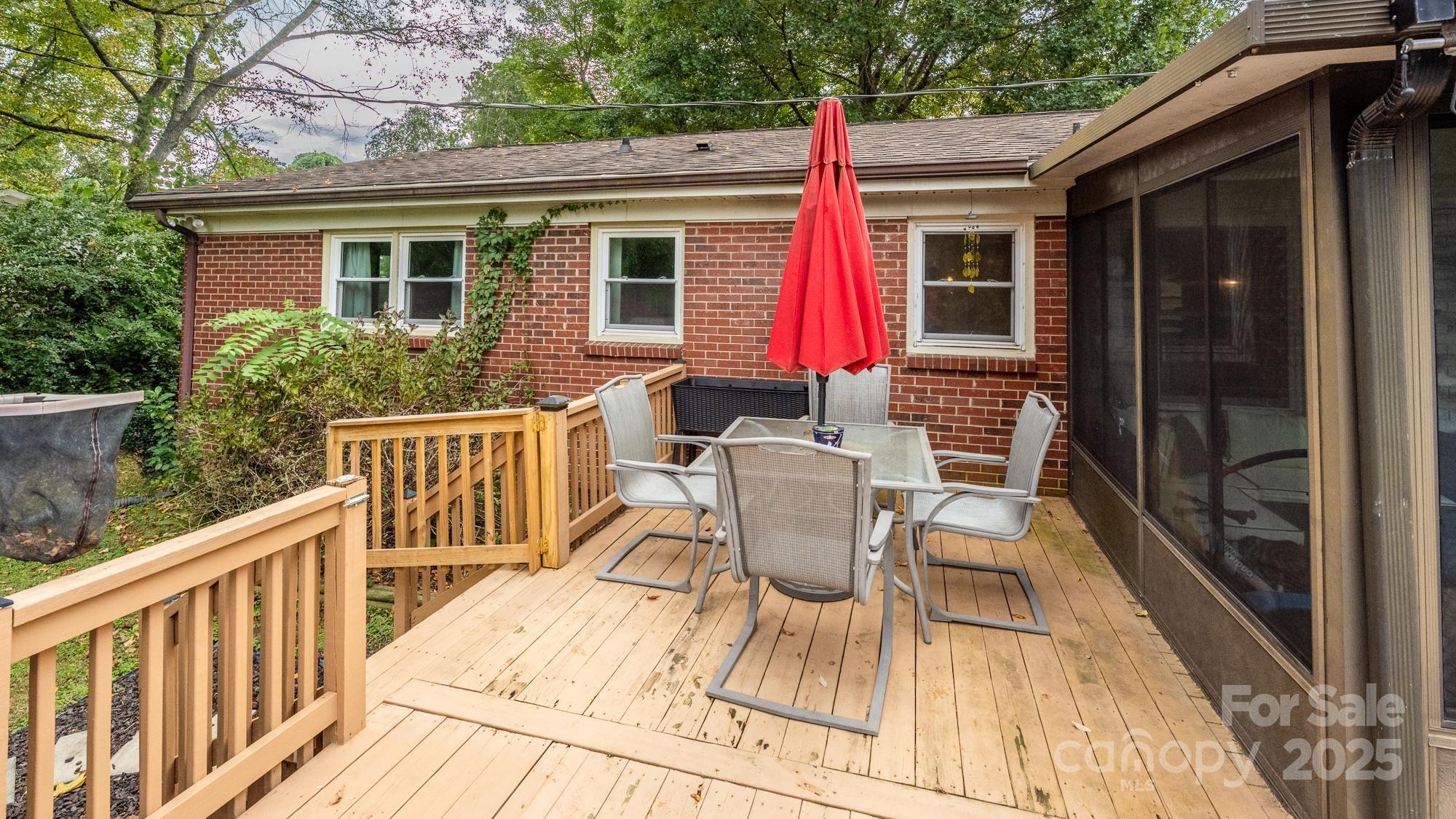 550 Brumley Road Mooresville, NC 28115 - Photo 35 of 35 a view of a house with wooden deck and furniture