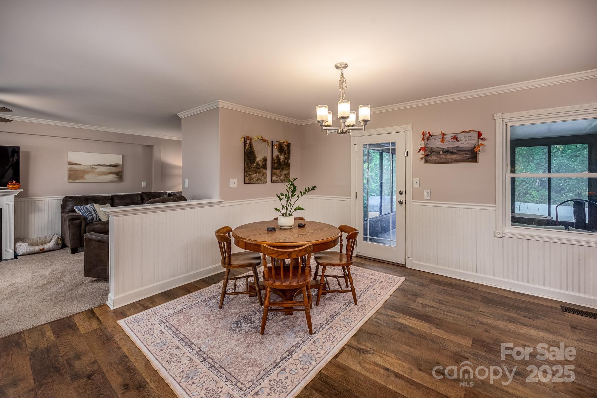 550 Brumley Road Mooresville, NC 28115 - Photo 5 of 35 a view of a dining room with furniture and wooden floor
