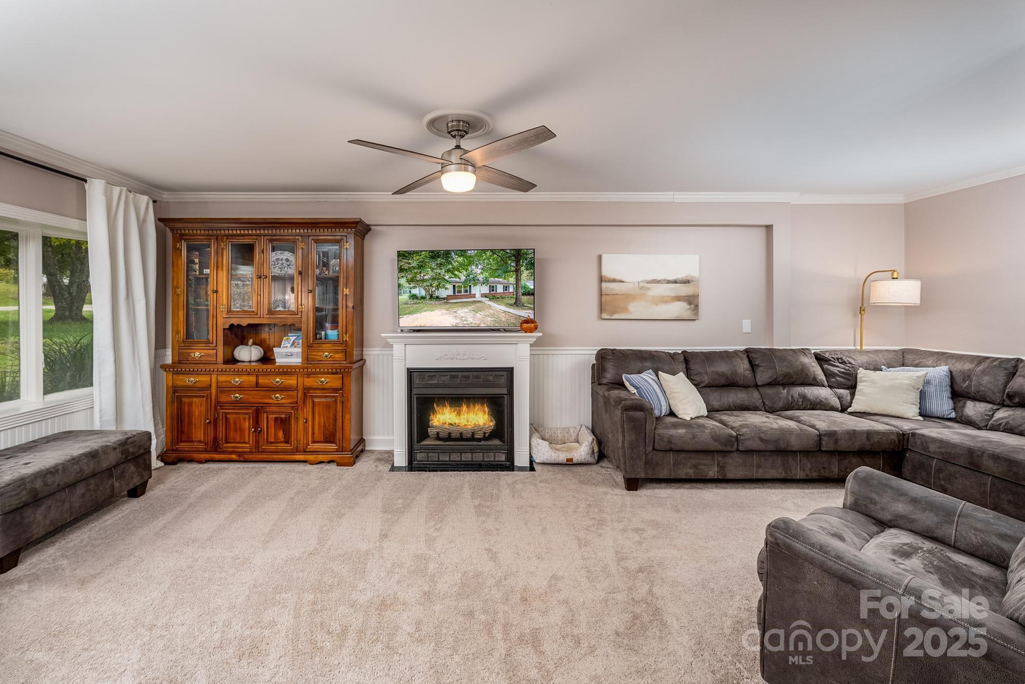 550 Brumley Road Mooresville, NC 28115 - Photo 6 of 35 a living room with furniture and a fireplace