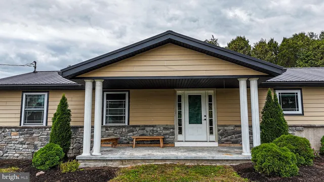 front view of a house with a yard