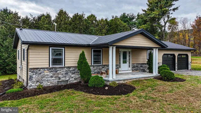a front view of a house with garden