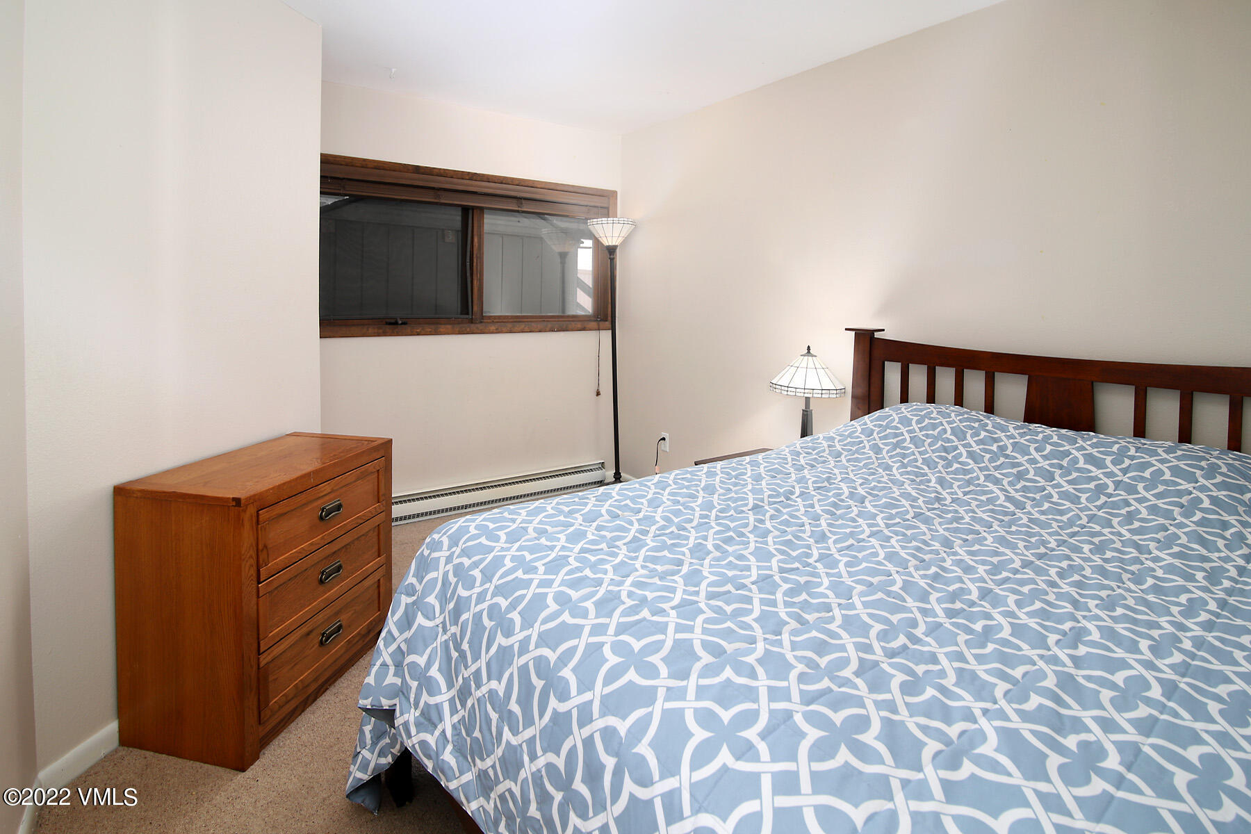 346 Eagle Road, Unit 2 Avon, CO 81620 - Photo 13 of 25 a bed room with a bed and a television