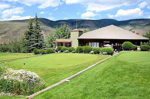 346 Eagle Road, Unit 2 Avon, CO 81620 - Photo 23 of 25 a view of a big house with a big yard and potted plants