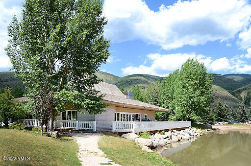 346 Eagle Road, Unit 2 Avon, CO 81620 - Photo 24 of 25 a view of swimming pool with outdoor seating and lake view