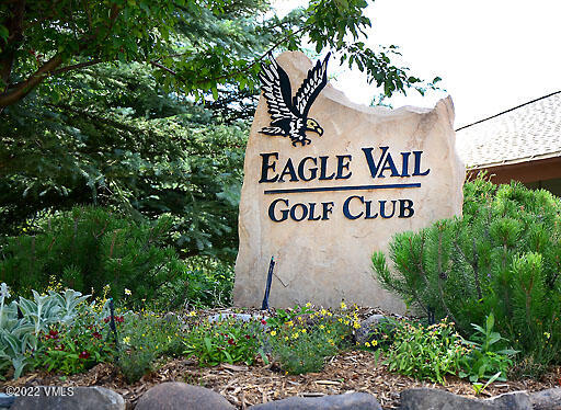 346 Eagle Road, Unit 2 Avon, CO 81620 - Photo 25 of 25 a sign broad in front of flowers