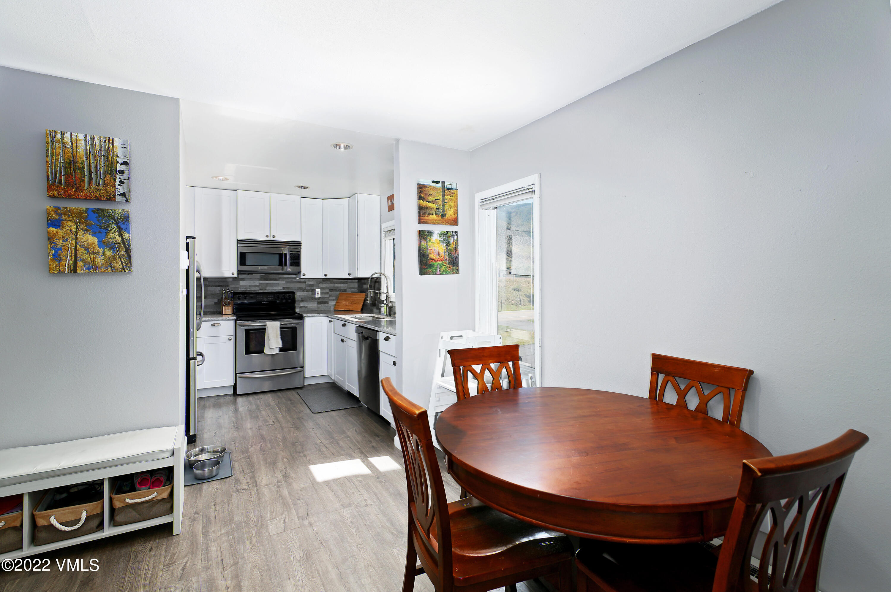 346 Eagle Road, Unit 2 Avon, CO 81620 - Photo 5 of 25 a living room with stainless steel appliances furniture a dining table and kitchen view
