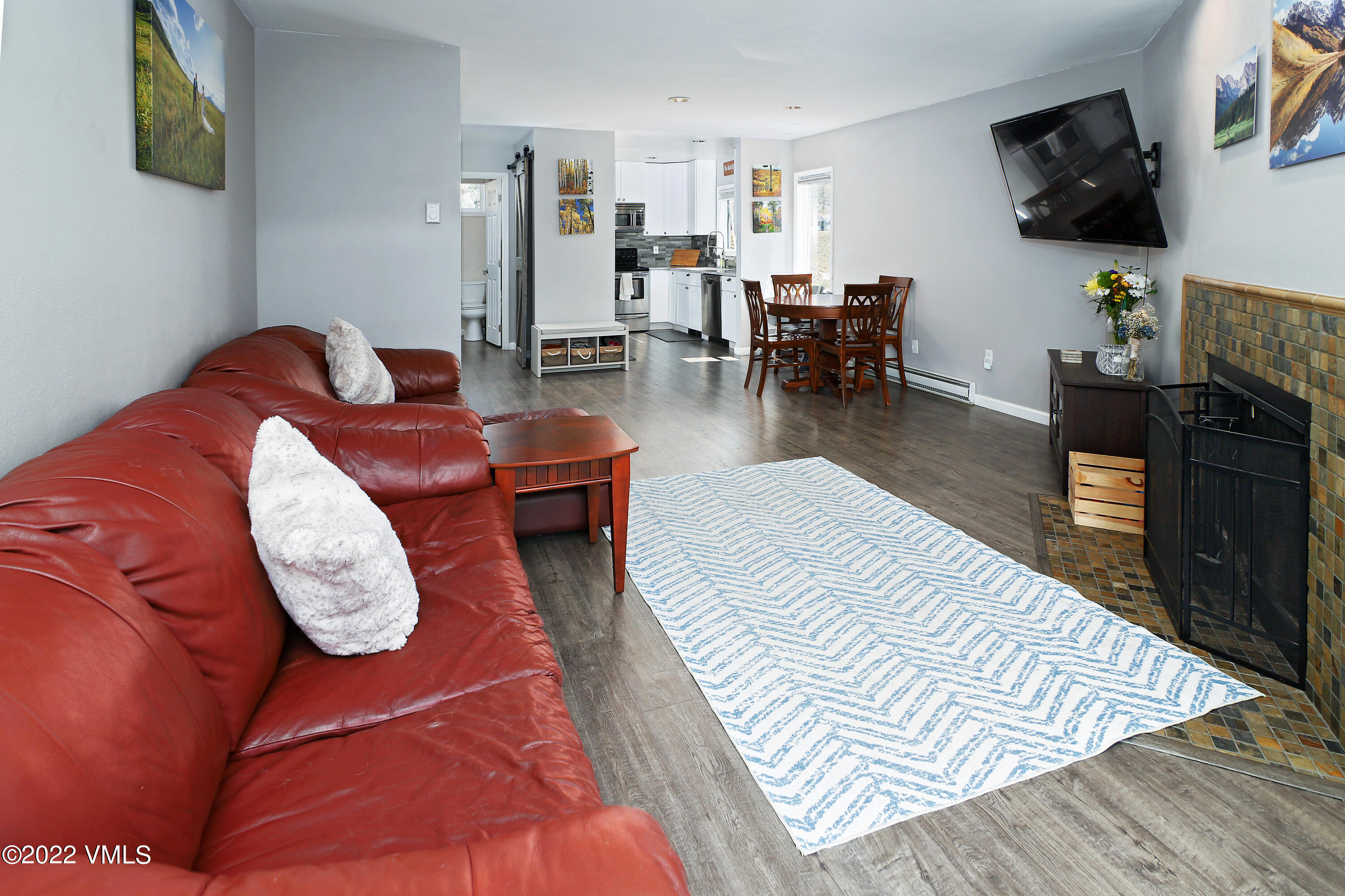 346 Eagle Road, Unit 2 Avon, CO 81620 - Photo 7 of 25 a living room with furniture and a flat screen tv