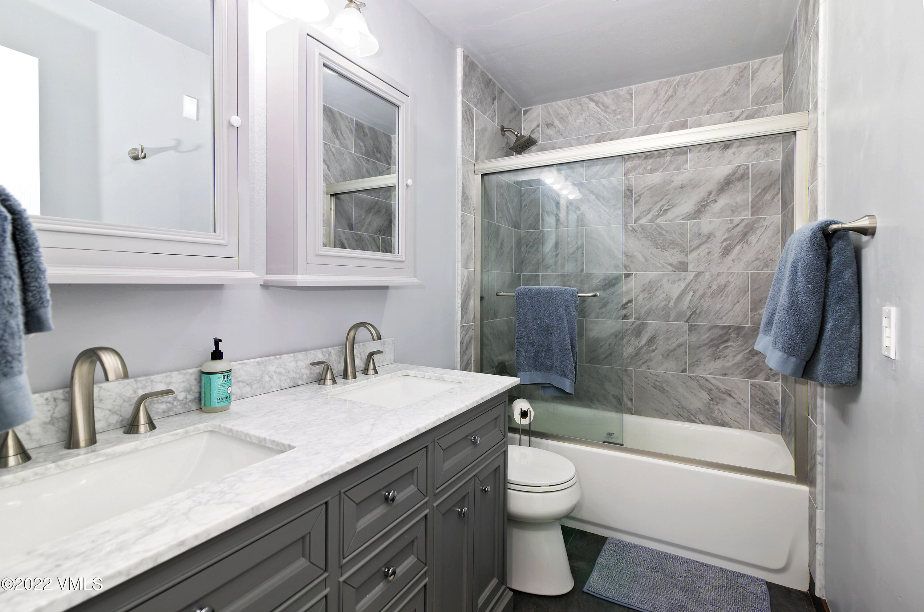 346 Eagle Road, Unit 2 Avon, CO 81620 - Photo 10 of 25 a bathroom with a granite countertop sink toilet and shower