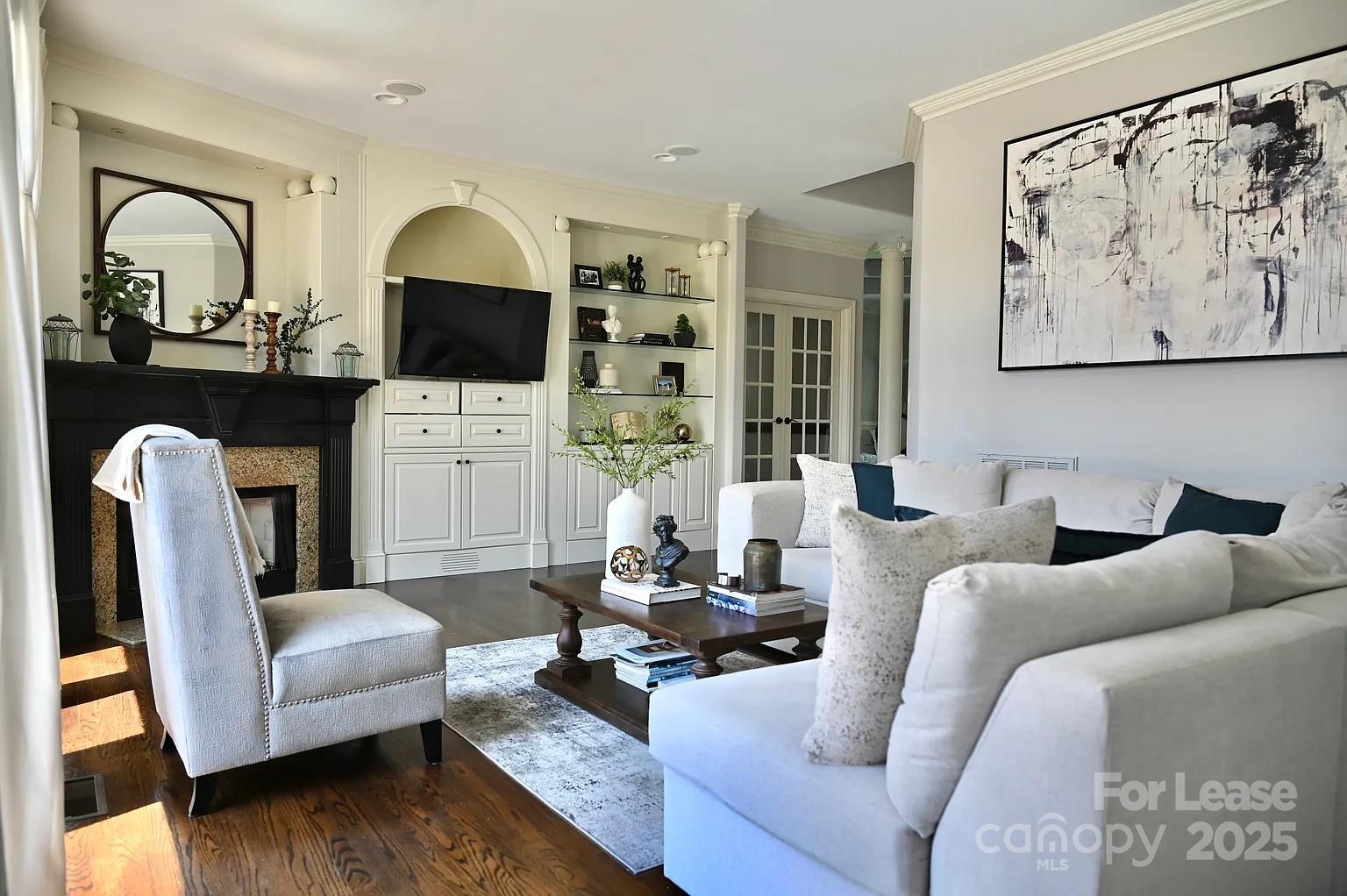 17234 Jetton Road Cornelius, NC 28031 - Photo 11 of 32 a living room with furniture fireplace and flat screen tv