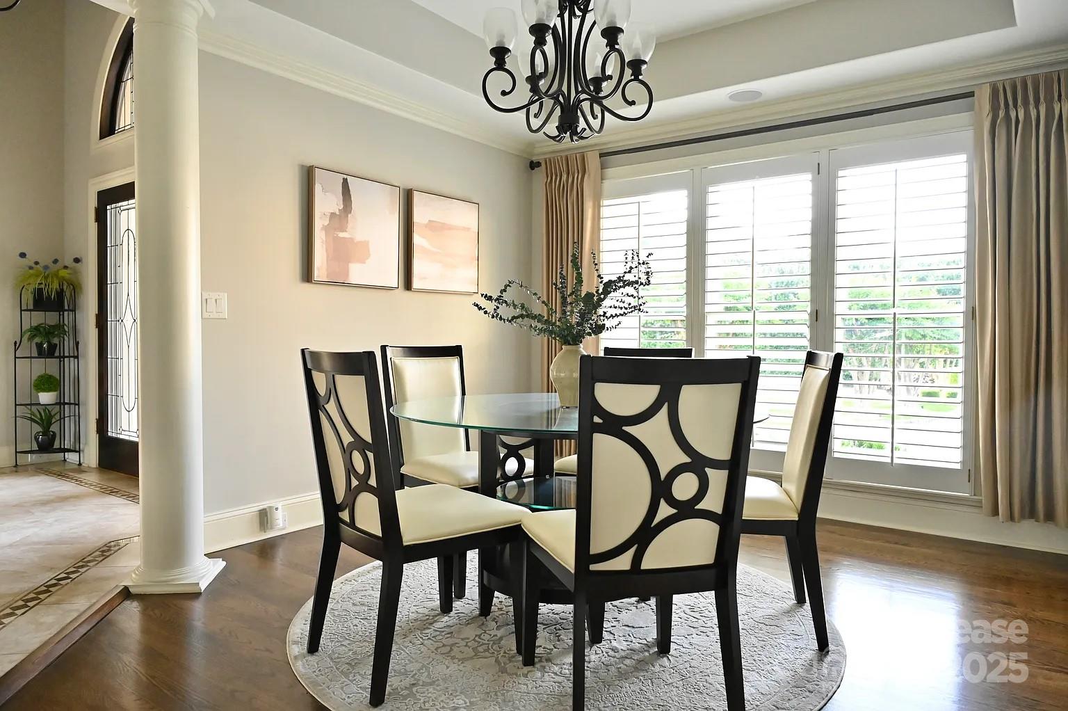 17234 Jetton Road Cornelius, NC 28031 - Photo 13 of 32 a view of a dining room with furniture window and wooden floor