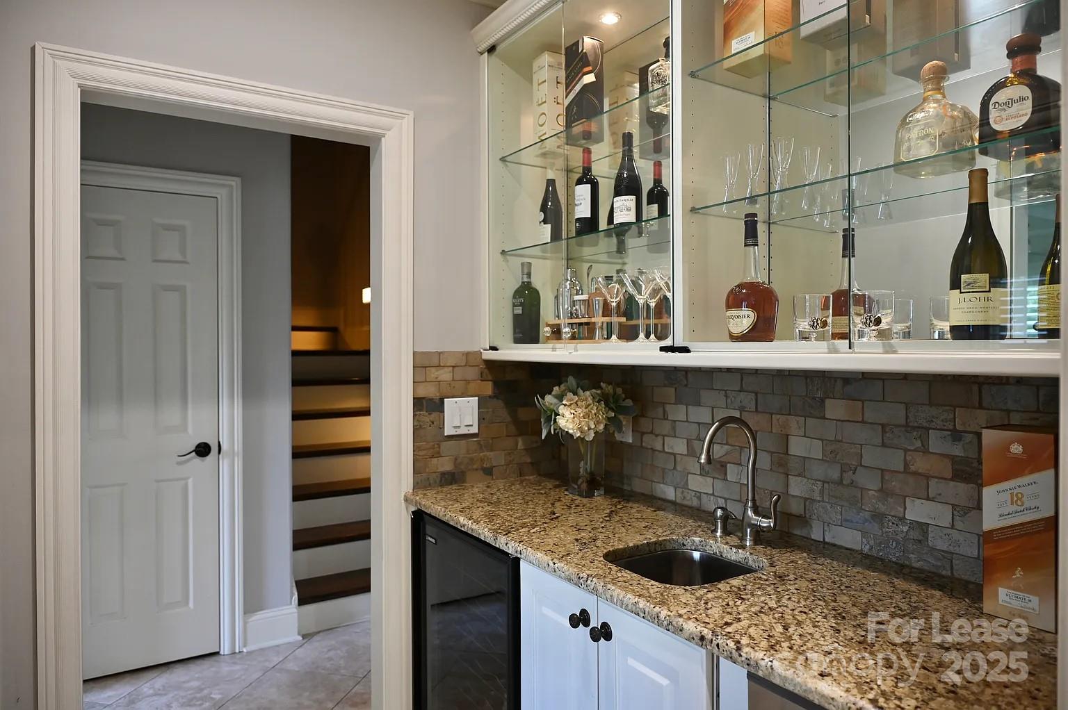 17234 Jetton Road Cornelius, NC 28031 - Photo 17 of 32 a kitchen with a sink and cabinets
