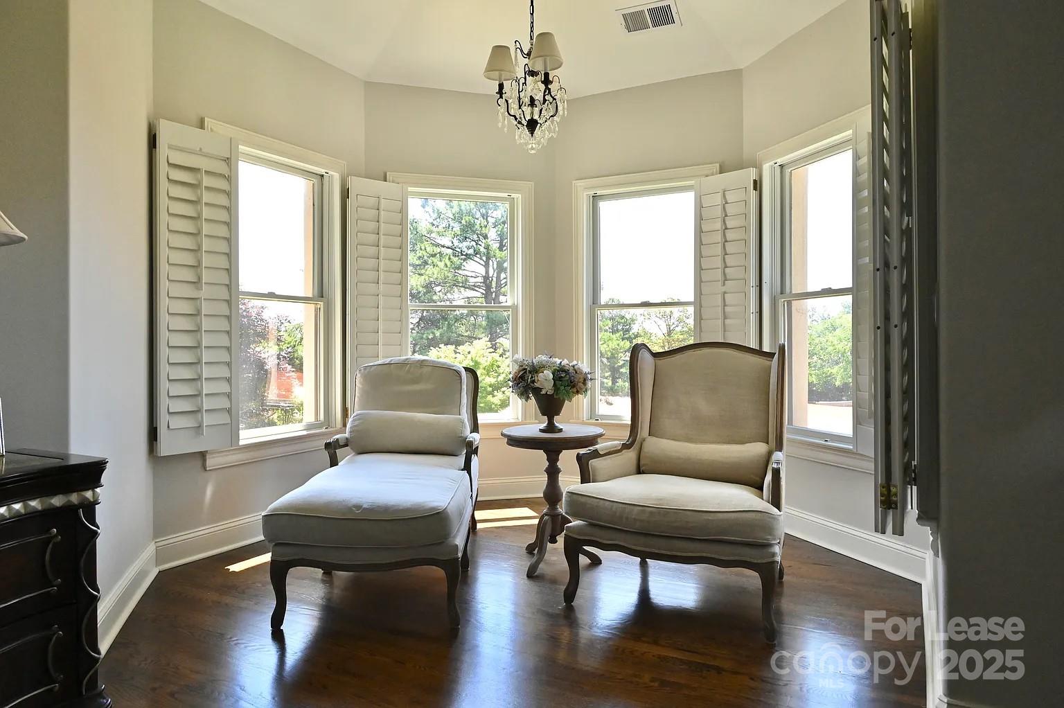 17234 Jetton Road Cornelius, NC 28031 - Photo 21 of 32 a living room with furniture wooden floor and a window