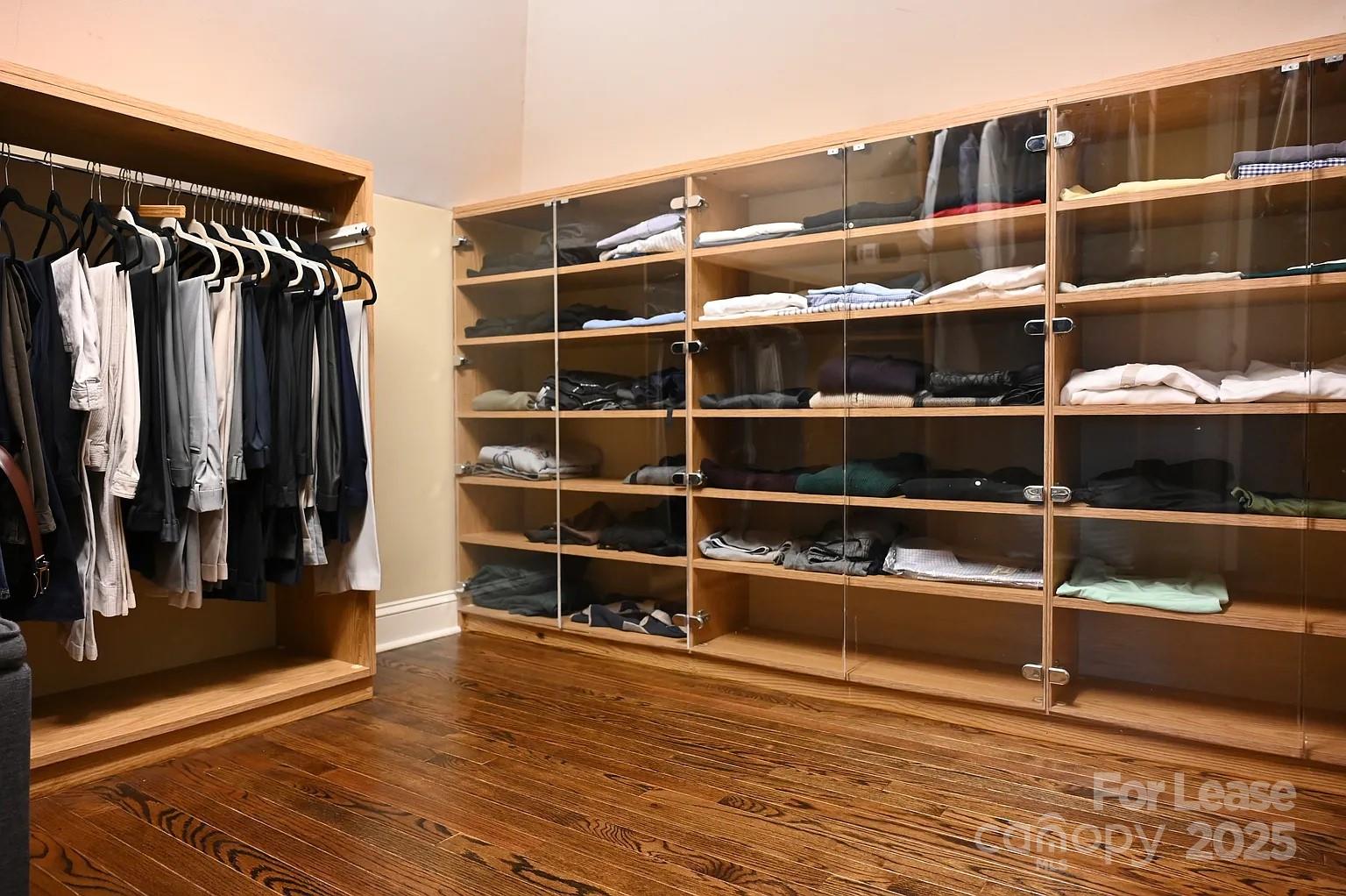 17234 Jetton Road Cornelius, NC 28031 - Photo 23 of 32 a view of walk in closet with clothes and shoes