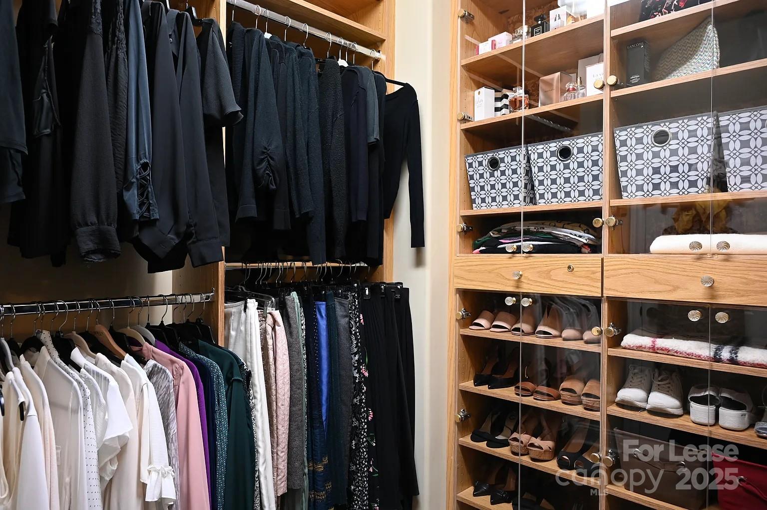 17234 Jetton Road Cornelius, NC 28031 - Photo 24 of 32 a view of walk in closet with clothes and shoes